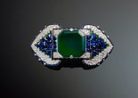 Brooch set with emeralds, sapphires and diamonds by Cartier, Paris, France, 1922, credit The Al Thani Collection © Servette Overseas Limited, 2014, ph. Prudence Cuming Associates Ltd.